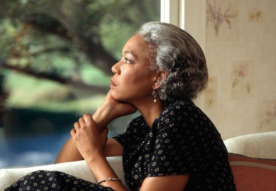 An image of a pensive older woman